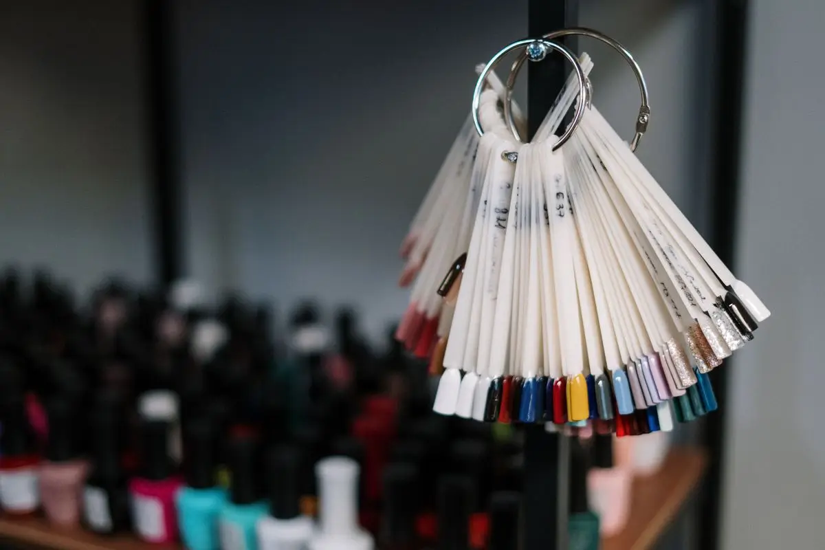 Colorful nail polish samples on display in a beauty salon.