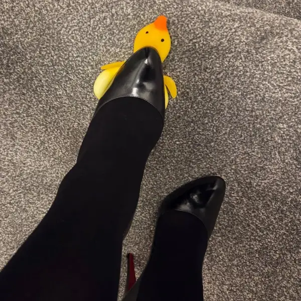 Confidence in heels with a touch of fun. 🐥👠